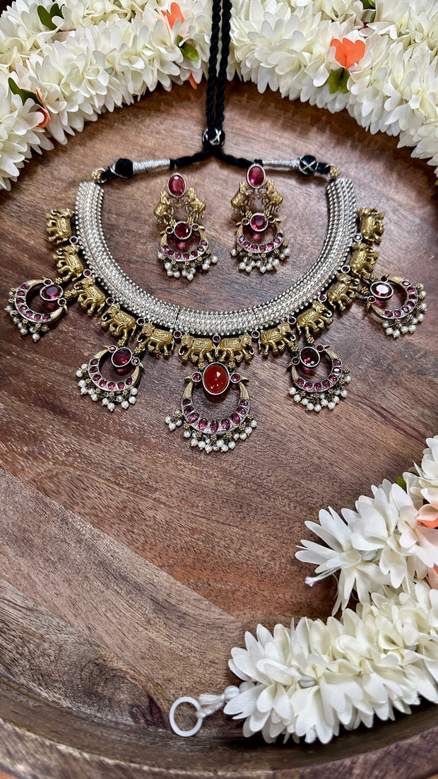 Dual tone necklace with red stone and earring