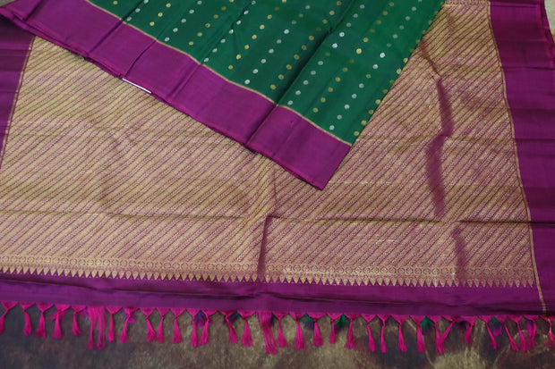 Bottle green and wine red kanchipuram silk hand woven saree with stitched blouse