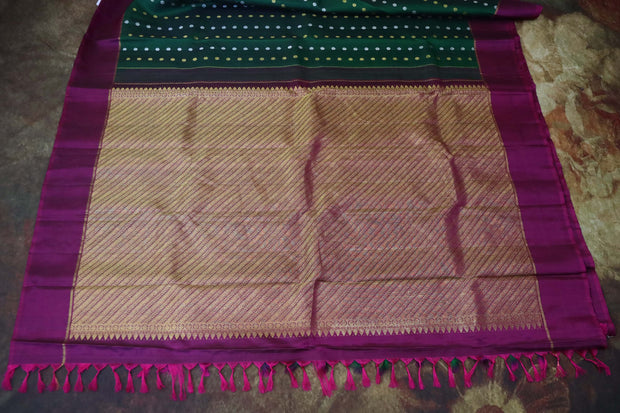 Bottle green and wine red kanchipuram silk hand woven saree with stitched blouse