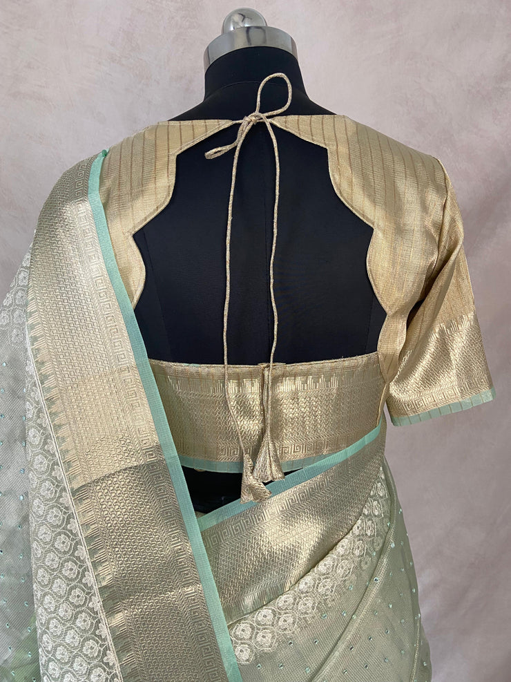 Light green Tissue Kotta silk saree with mirror and chikankari work, with stitched blouse