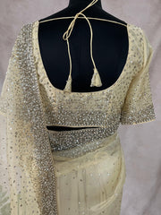 Soft Organza Light Yellow color saree with sequins work and stitched blouse