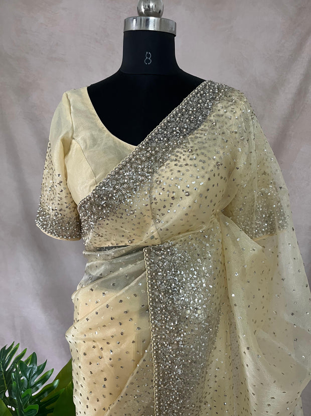 Soft Organza Light Yellow color saree with sequins work and stitched blouse