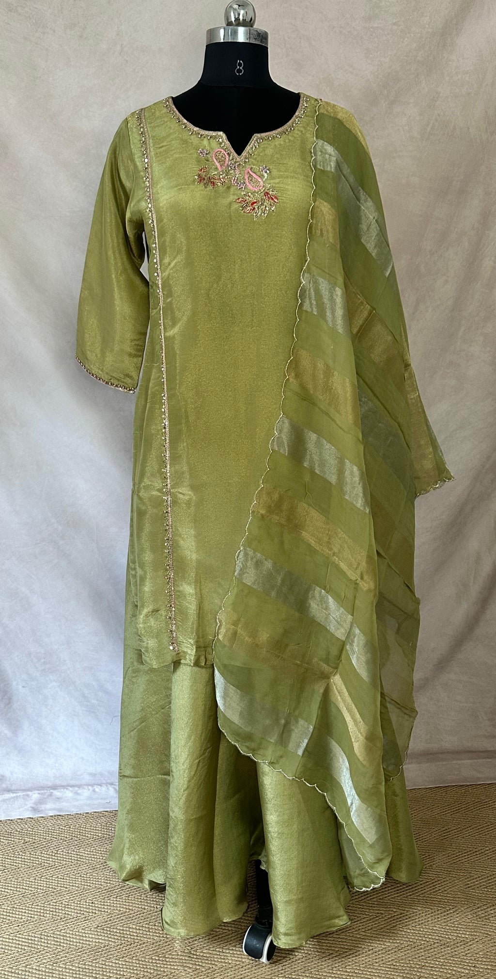 Olive green tissue silk short kuti with hand emroidery and flared palazzo and dupatta