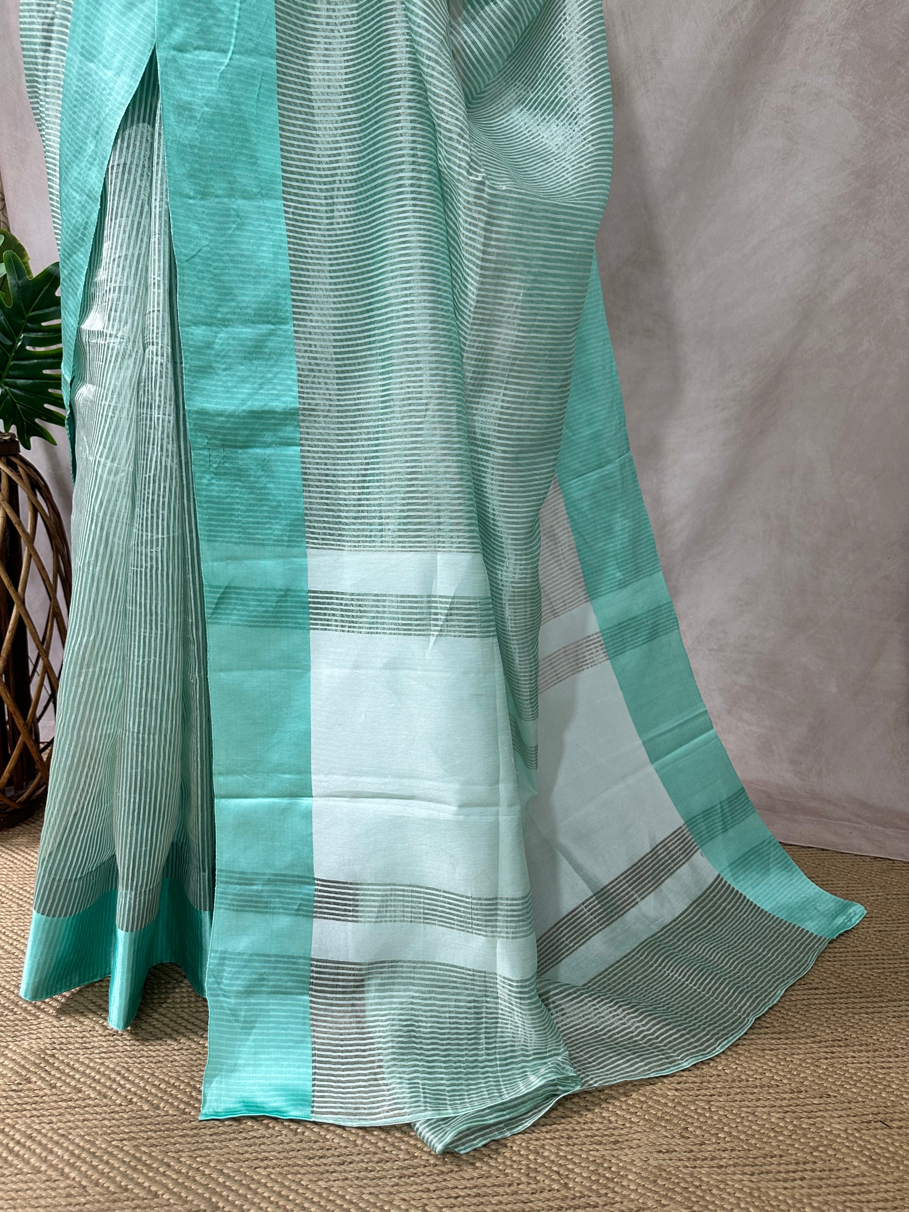 Light pista green stripe tissue silk saree with stitched blouse