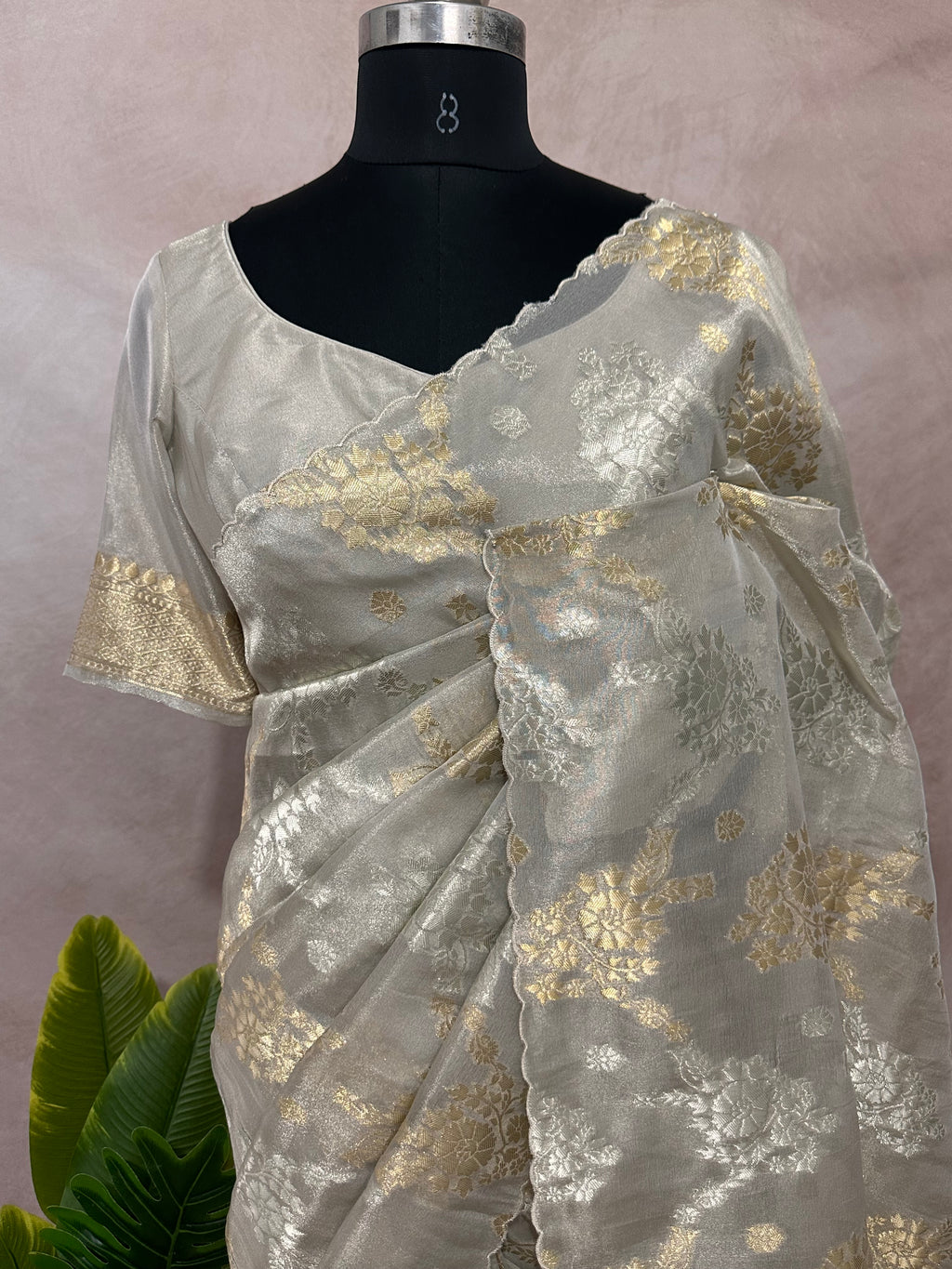Silver tissue saree with gold floral weave, with stitched blouse