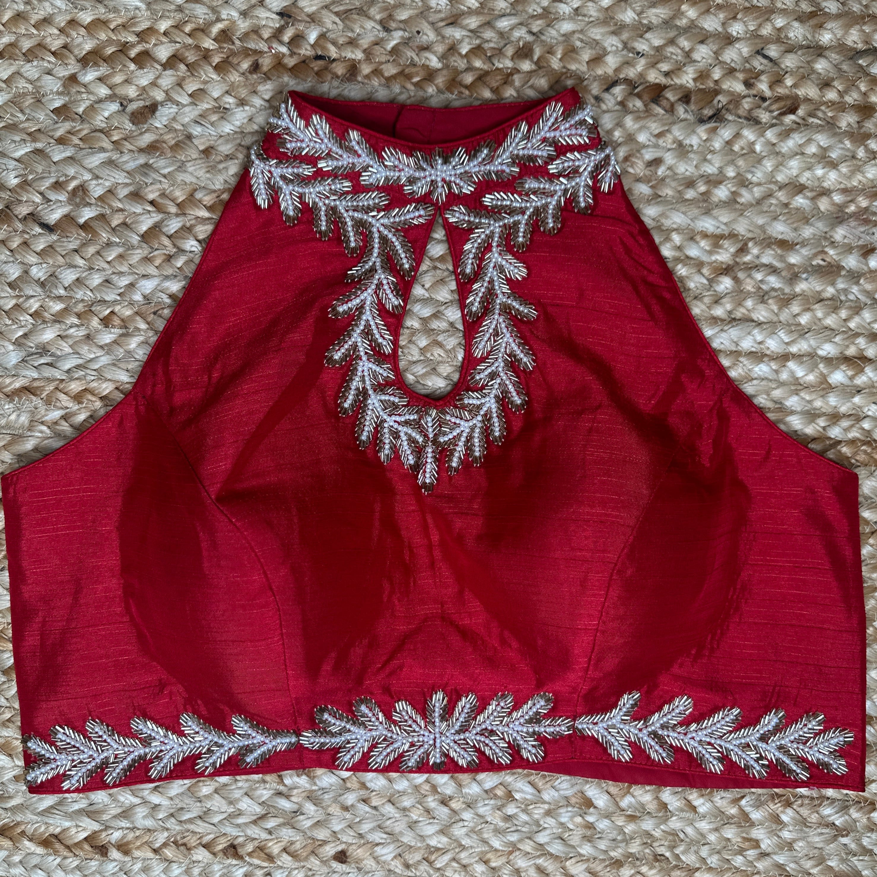 Red halter neck blouse with bead work