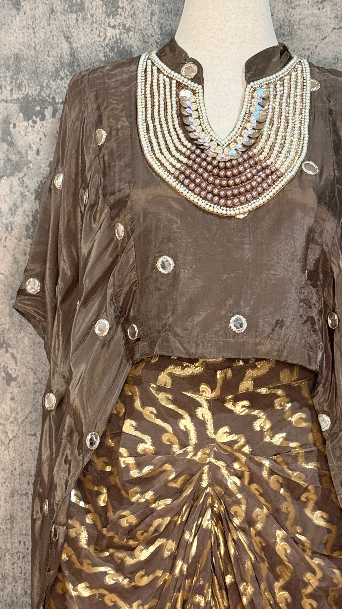 designer top with drape skirt