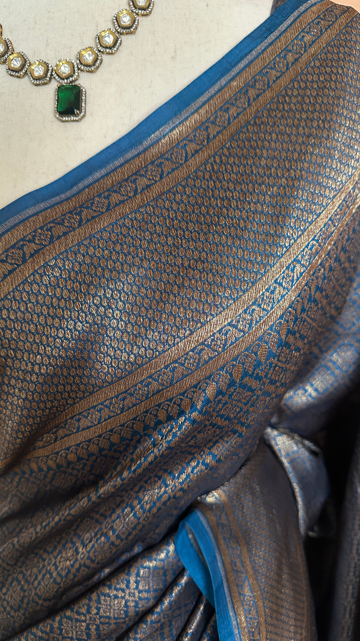Blue brocade organza saree with stitched blouse