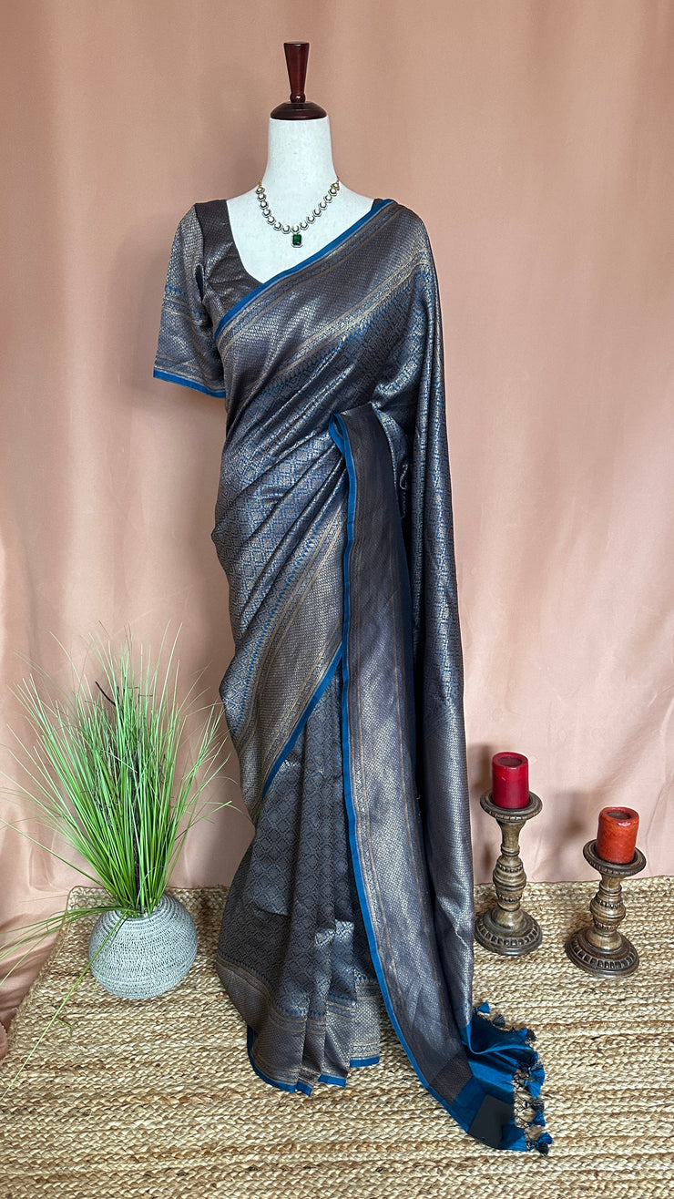 Blue brocade organza saree with stitched blouse