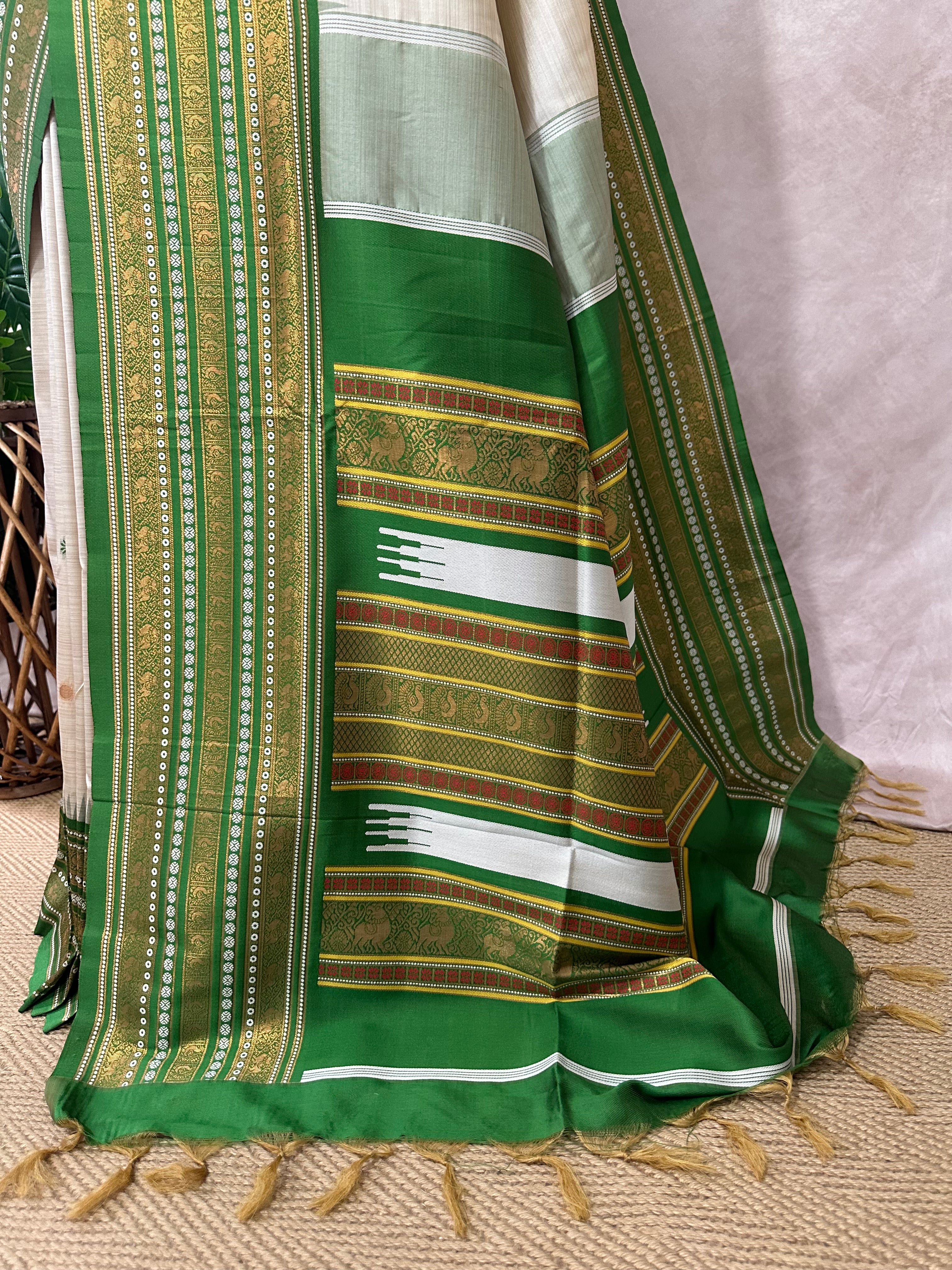 Asam silk saree with green border and stitched blouse