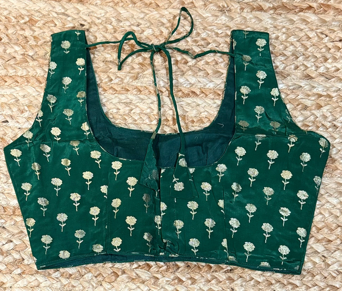 Green sleeveless blouse with gold print