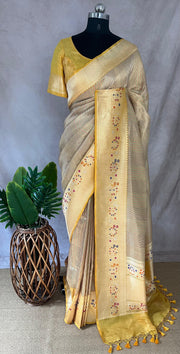 Yellow tissue organza saree with katan border with meenakari weave, stitched blouse