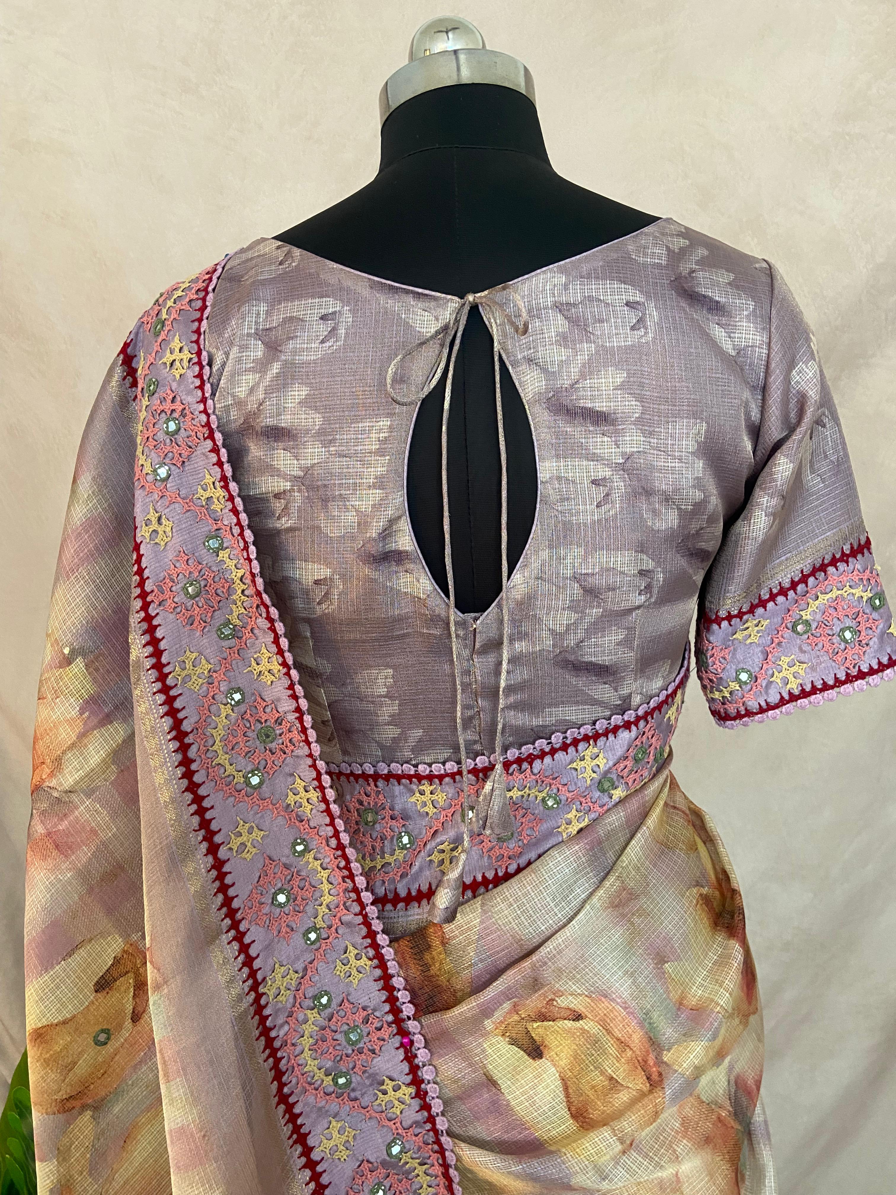 Tissue kotta saree with kutch work border and stitched blouse