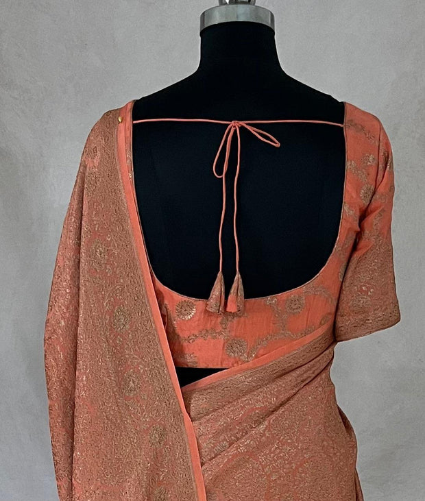 Pure Crepe silk saree with antique zari weave, stitched blouse