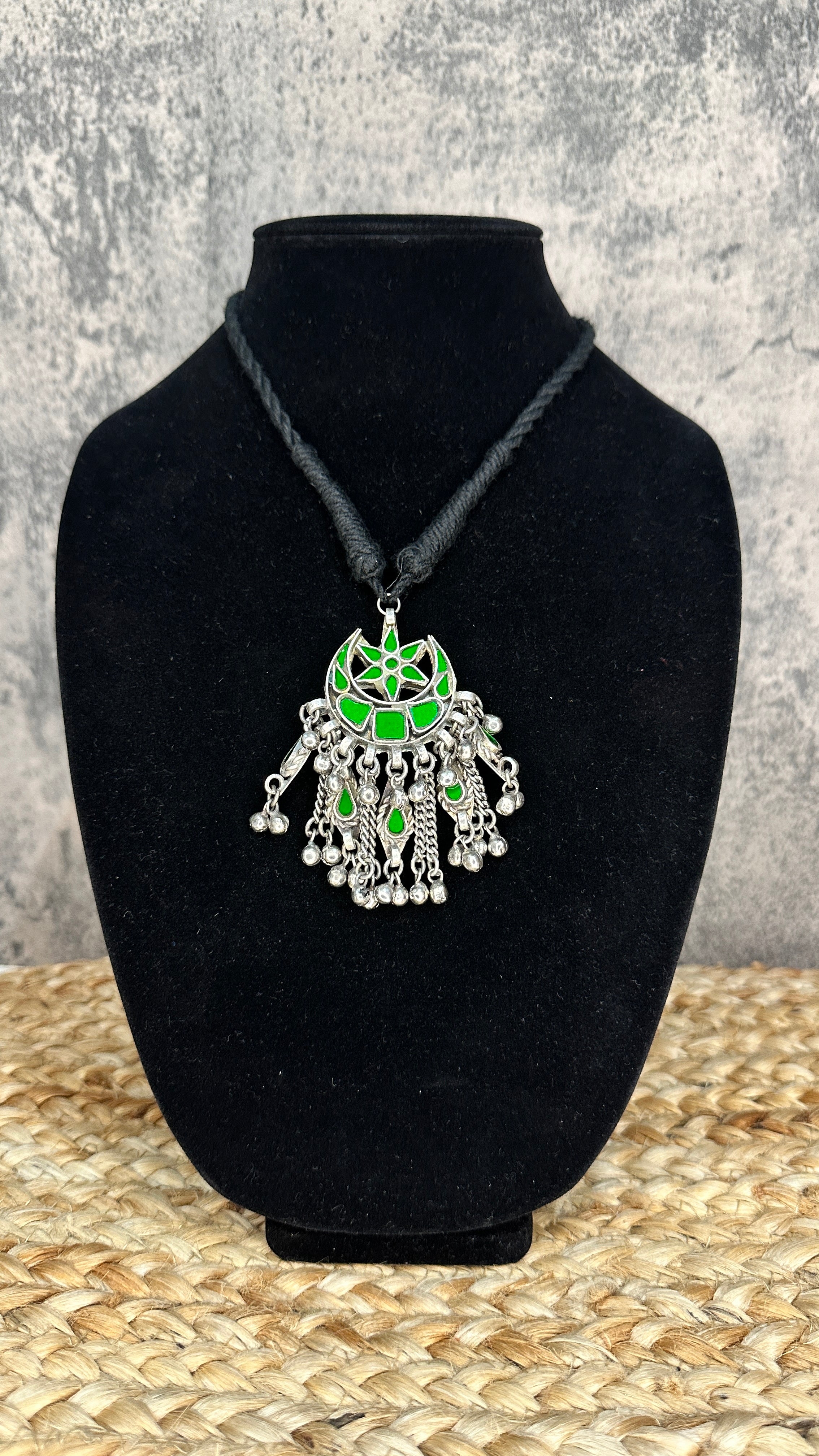 Indian green glass pendent with black thread