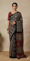 Designer Ajrakh modal silk saree with bead and mirroer handwork, stitched blouse