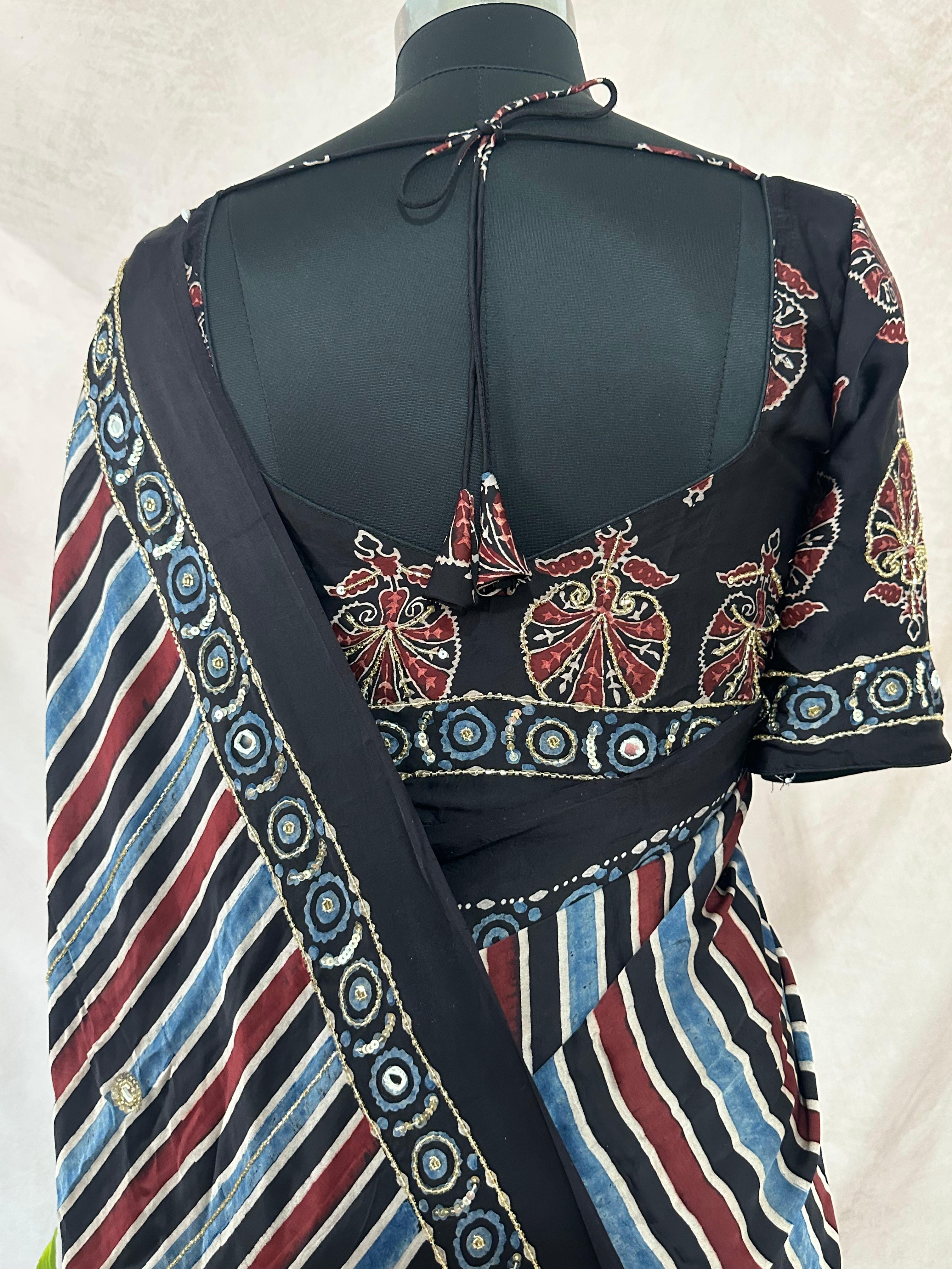 Designer Ajrakh modal silk saree with bead and mirroer handwork, stitched blouse