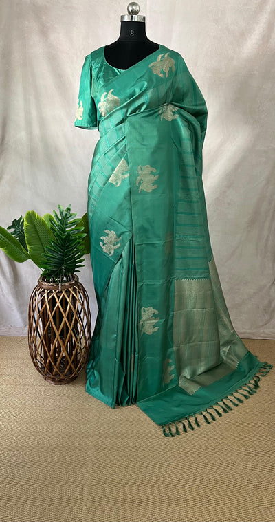 Light peacock Green Kanchivaram saree with stitched blouse
