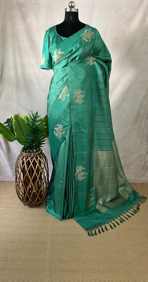 Light peacock Green Kanchivaram saree with stitched blouse