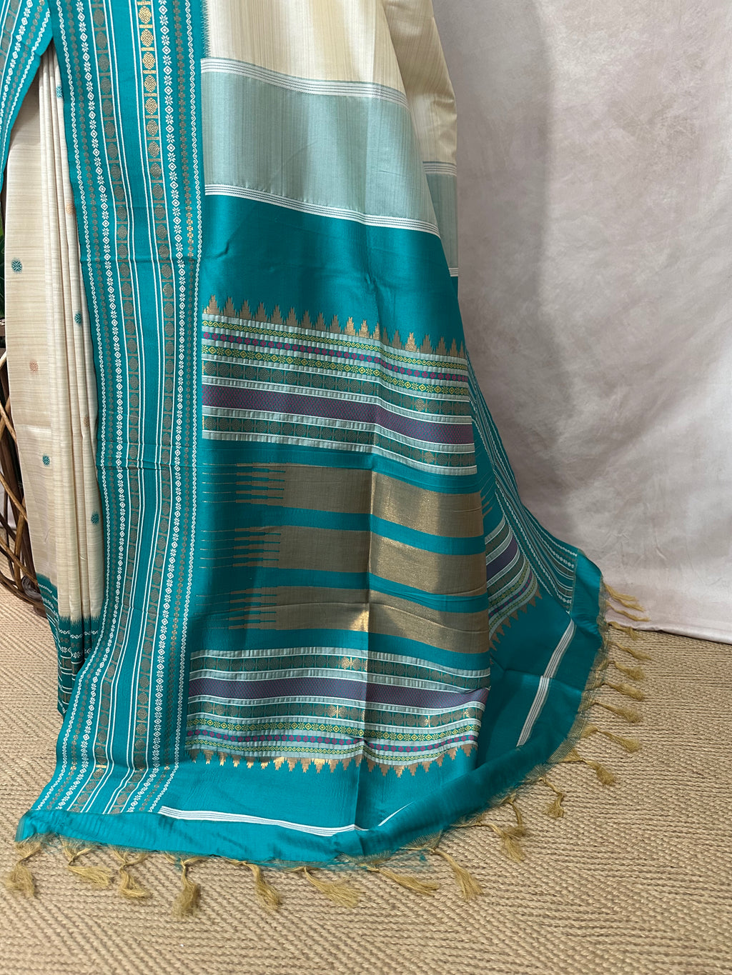 Asam silk saree with Turquoise green broder and stitched blouse