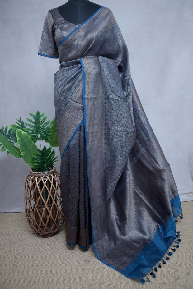 Blue brocade organza saree with stitched blouse