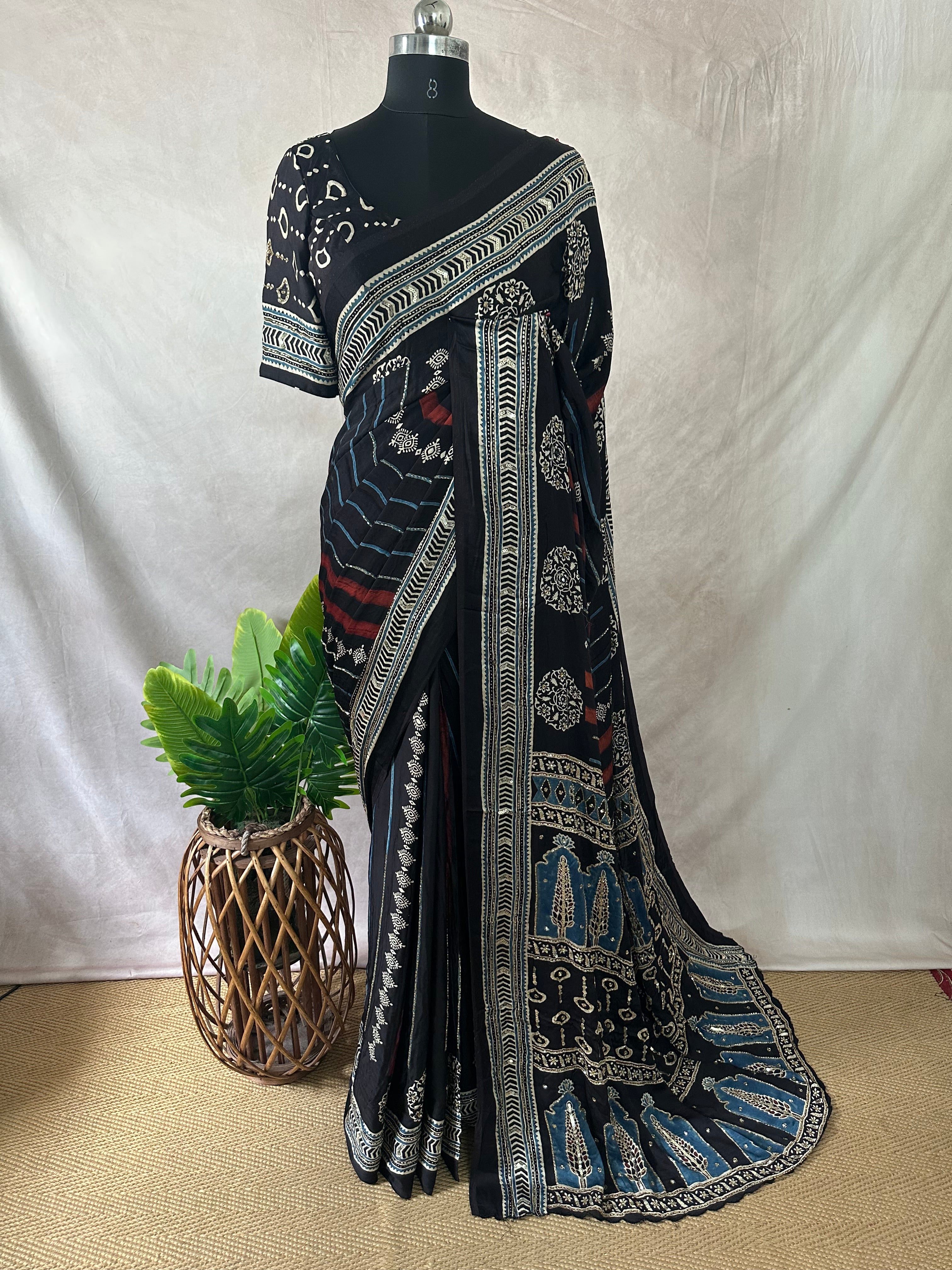 Modal silk saree with bead and mirror work , stitched blouse