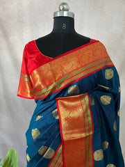 Peacock blue and red Kanchivaram saree with stitched blouse