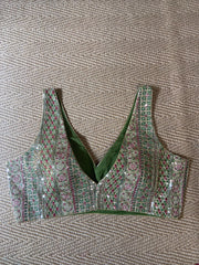 Green sleeveless blouse