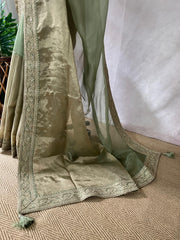 Green organze tissue saree with stitched blouse