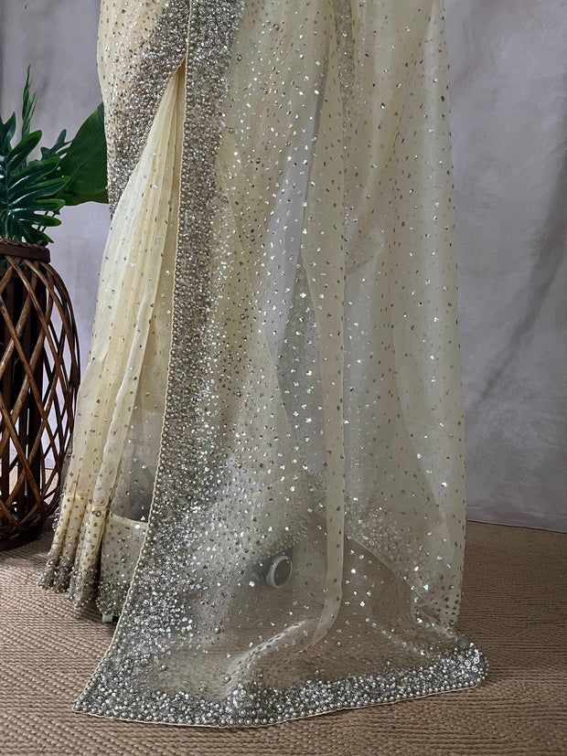 Soft Organza Light Yellow color saree with sequins work and stitched blouse