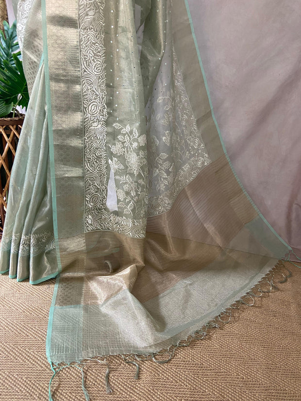 Light green Tissue Kotta silk saree with mirror and chikankari work, with stitched blouse