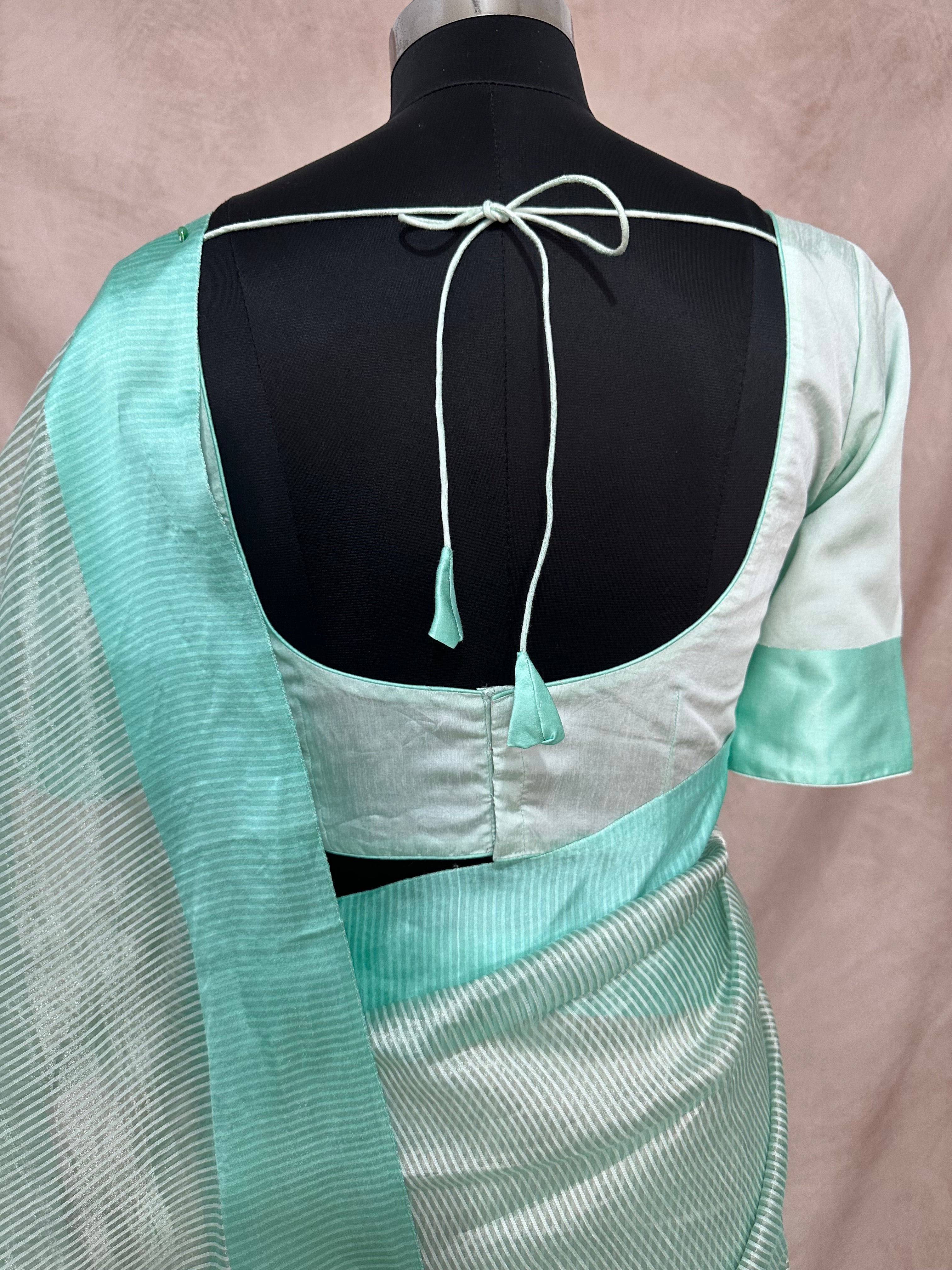 Light pista green stripe tissue silk saree with stitched blouse