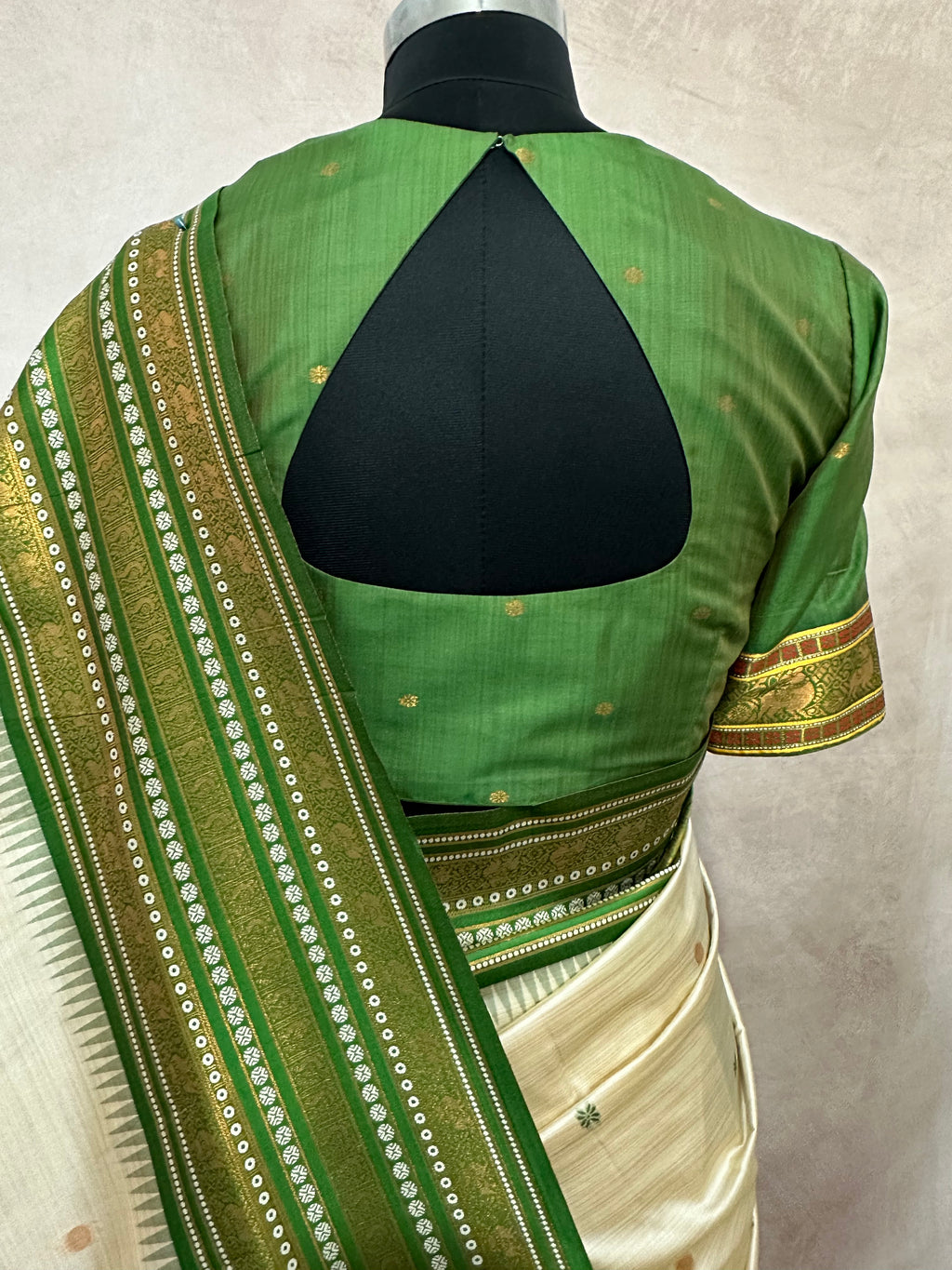 Asam silk saree with green border and stitched blouse