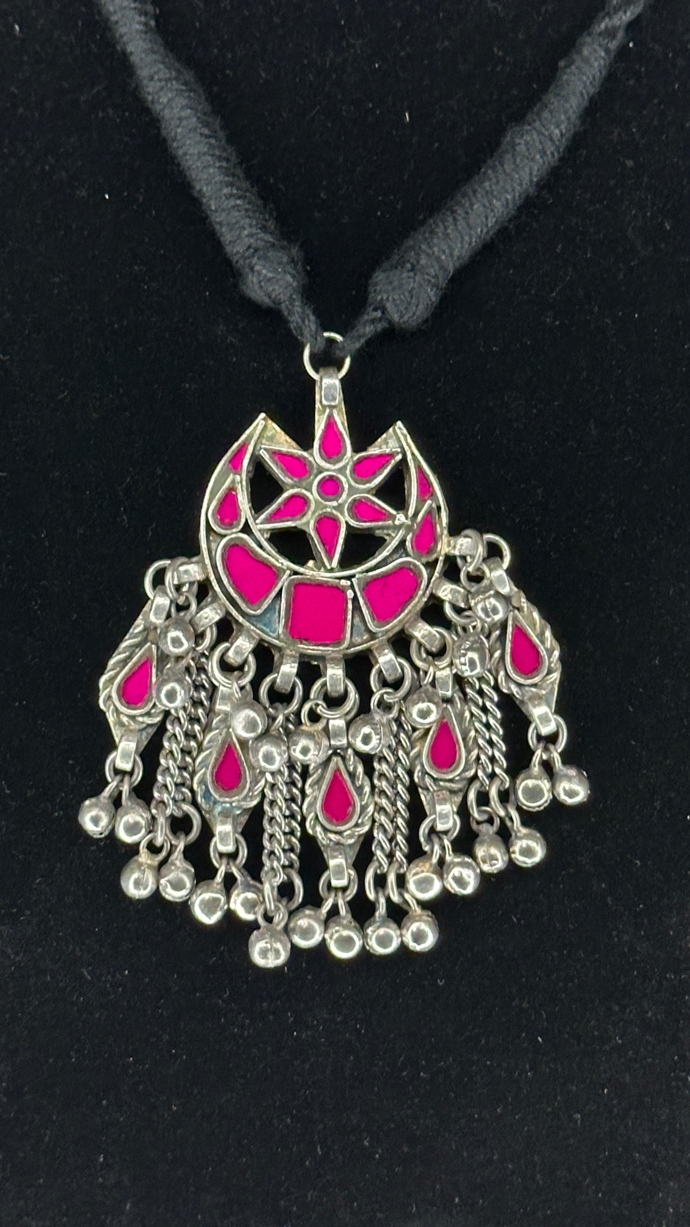 Indian Pink glass pendent with black thread