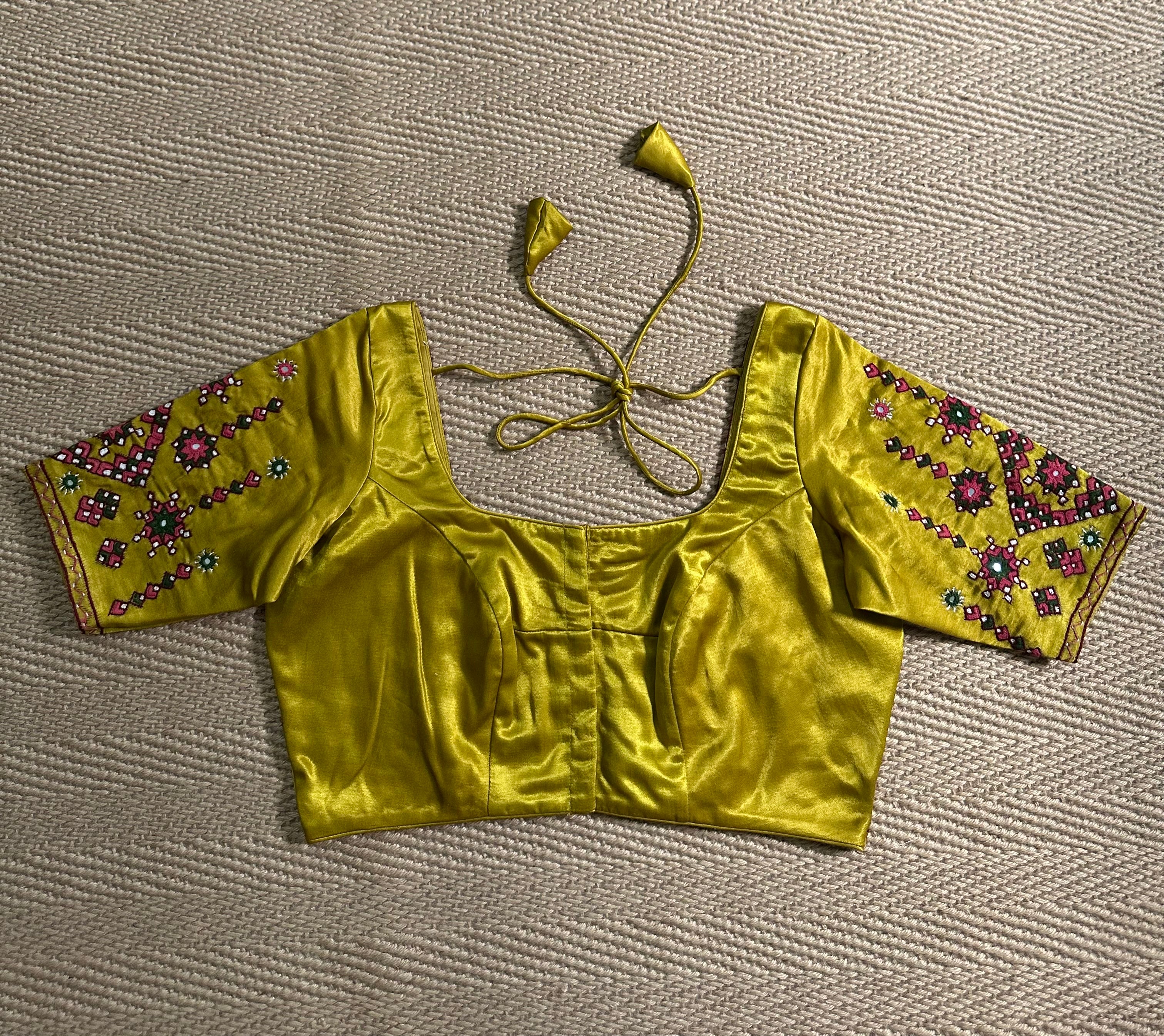 Yellow modal silk blouse with mirror work and hand Kutch Embroidery