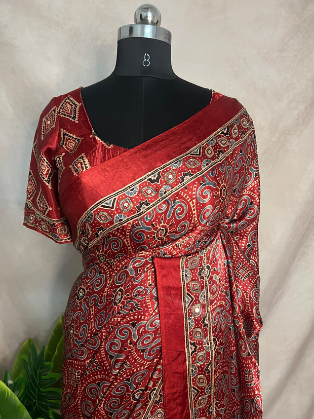 Red Ajrakh printed maroon modal silk saree with hadnwork and gharchola pallu, with stitched blouse
