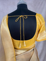 Yellow tissue organza saree with katan border with meenakari weave, stitched blouse
