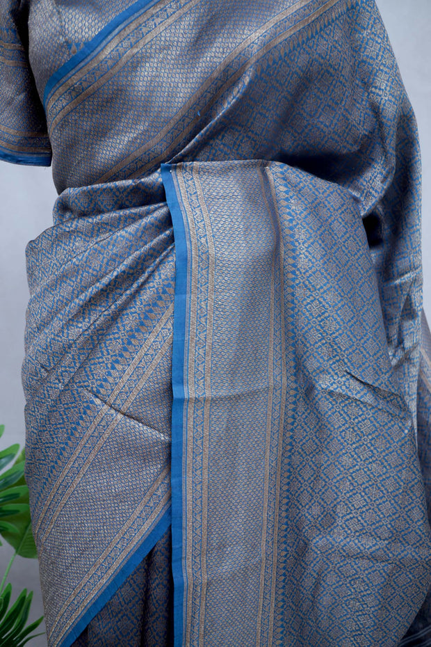 Blue brocade organza saree with stitched blouse