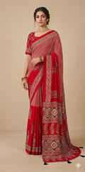 Designer Ajrakh modal silk saree with bead and mirror handwork, stitched blouse