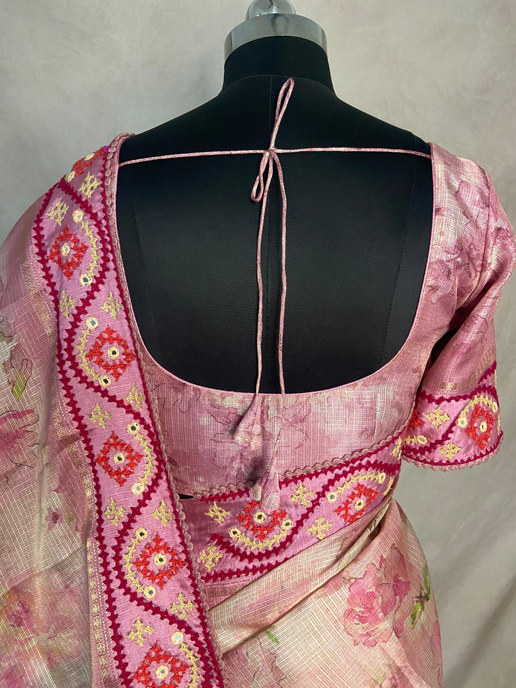 Tissue kotta saree with kutch work border and stitched blouse
