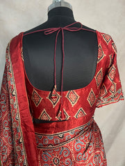 Red Ajrakh printed maroon modal silk saree with hadnwork and gharchola pallu, with stitched blouse