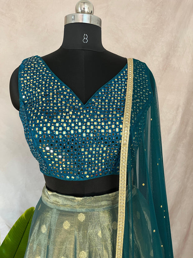Peacock blue tissue silk lehanga with mirror work blouse