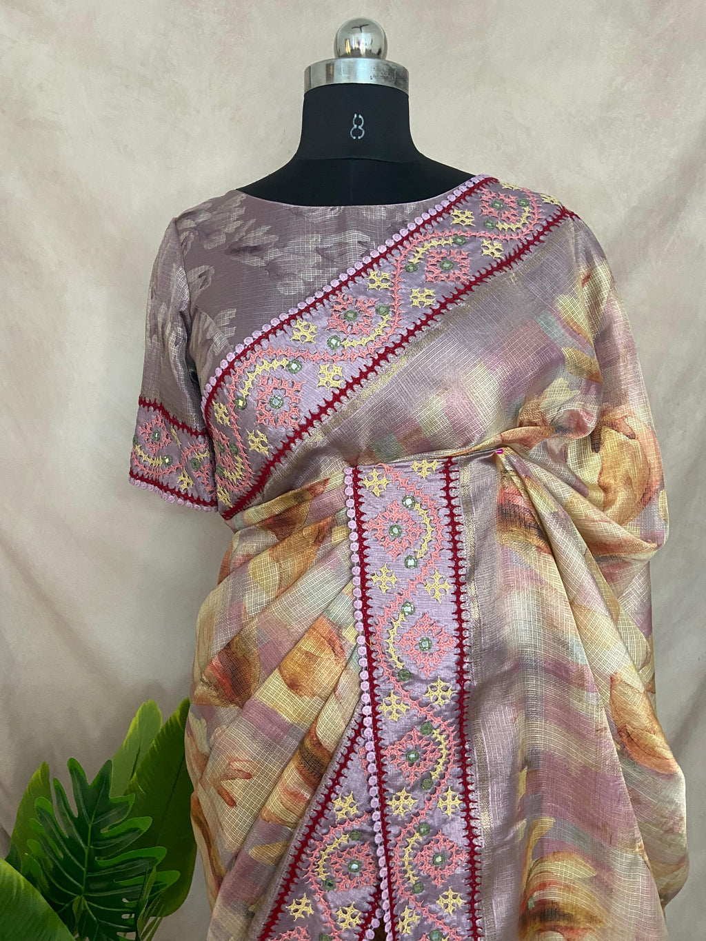 Tissue kotta saree with kutch work border and stitched blouse