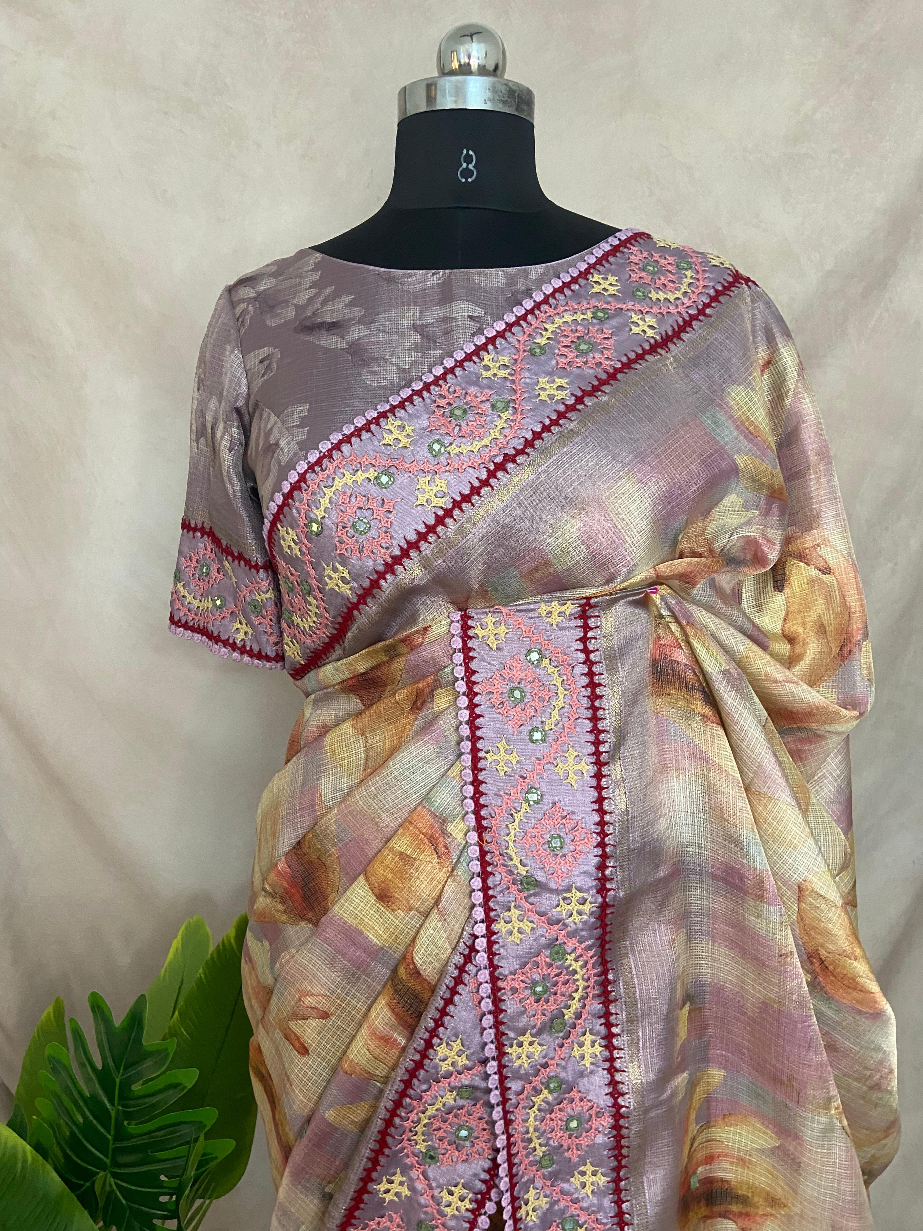 Tissue kotta saree with kutch work border and stitched blouse