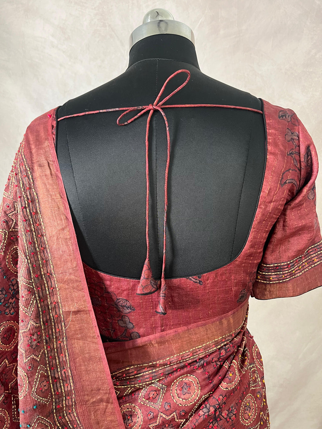 Pure tussar silk saree with Ajrakh hand block printed and high lighted with kanta work and stitched blouse