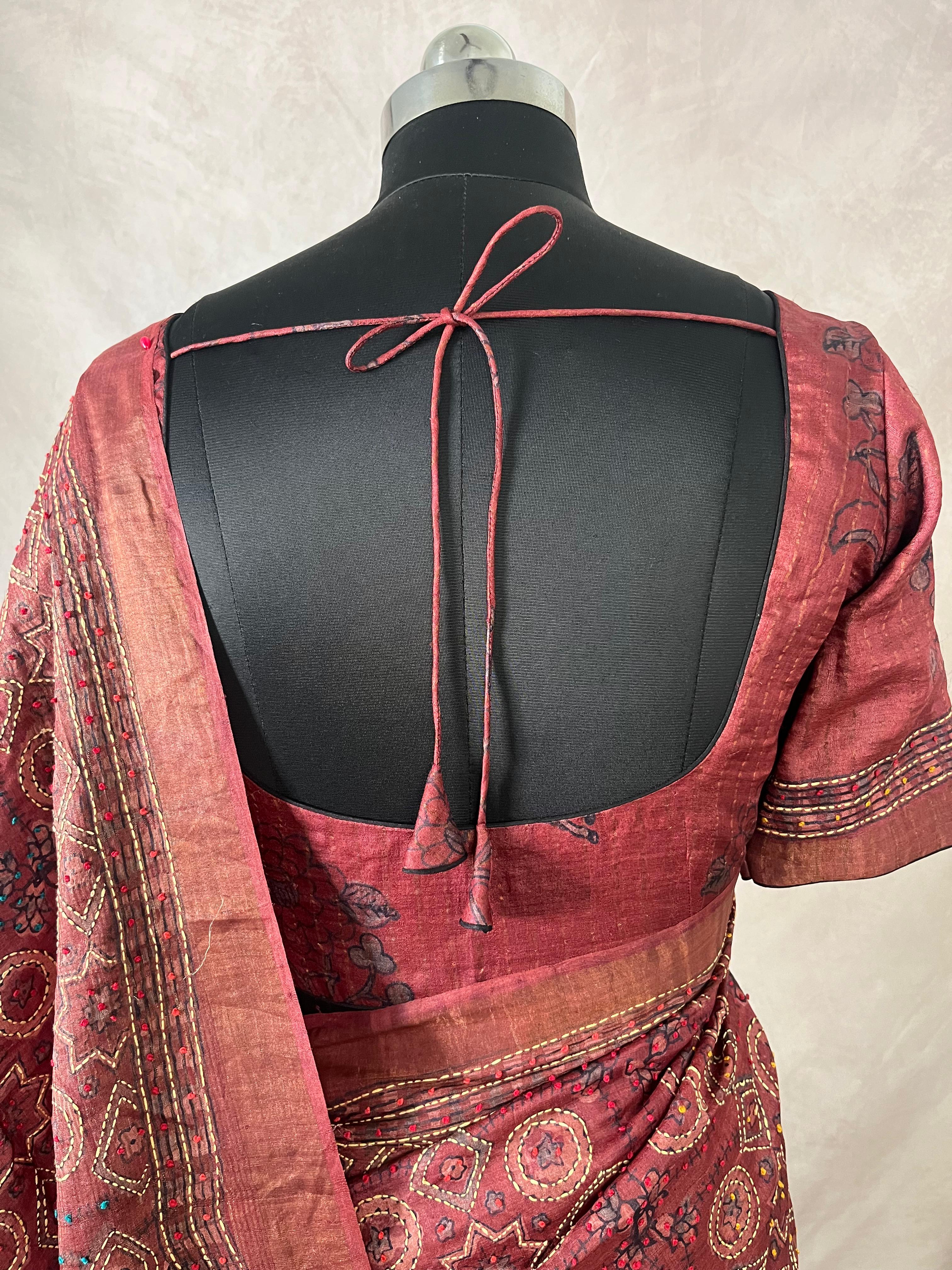 Pure tussar silk saree with Ajrakh hand block printed and high lighted with kanta work and stitched blouse