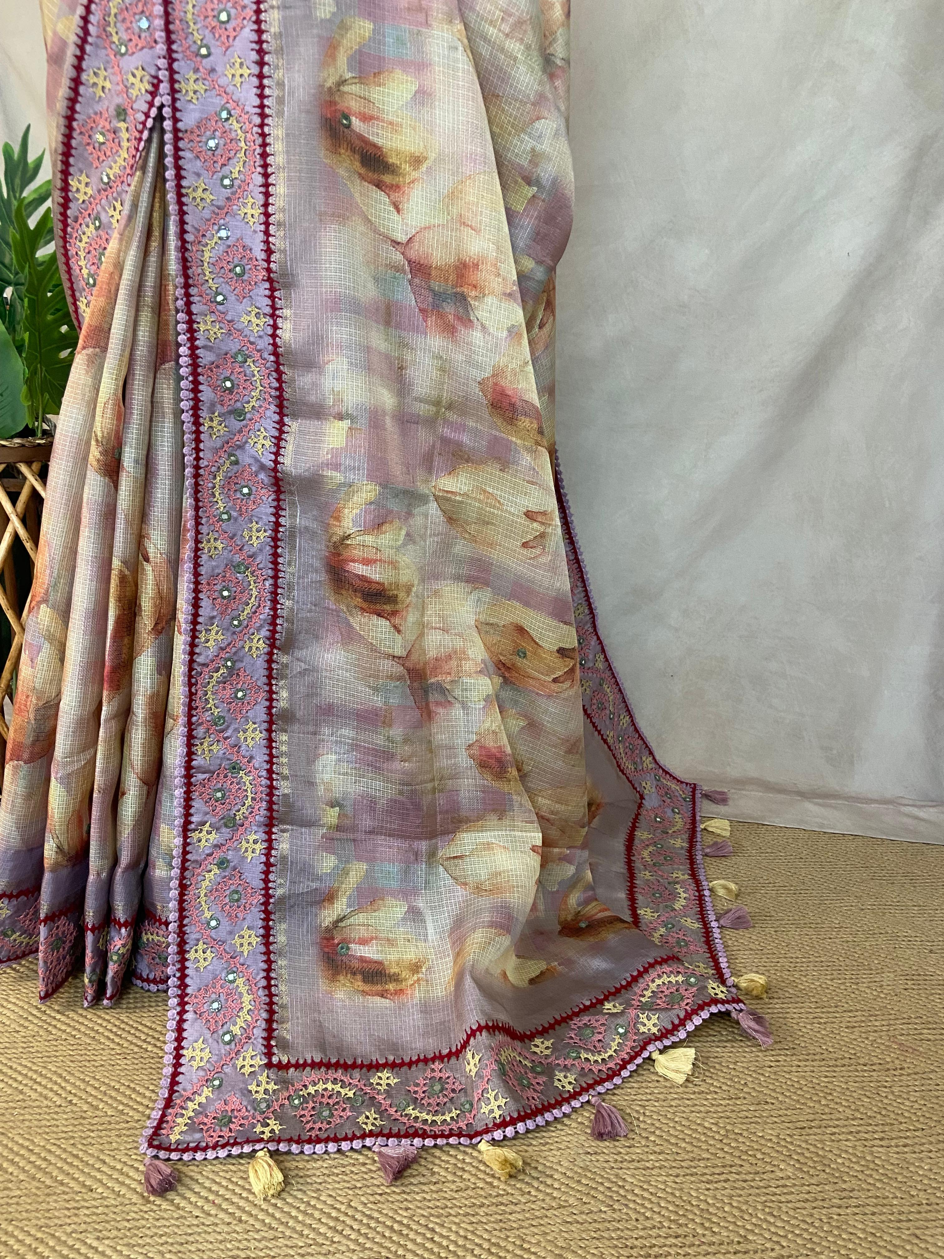Tissue kotta saree with kutch work border and stitched blouse