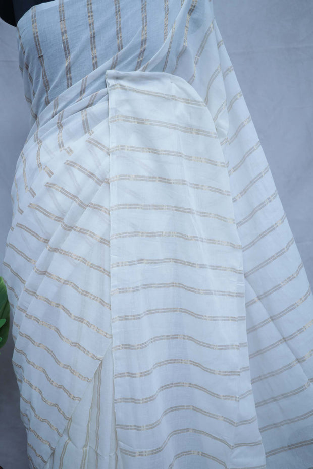 Off white cotton saree with gold stripe