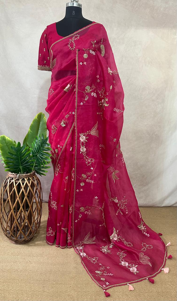 Pink organza saree with han embroidery and stitched blouse