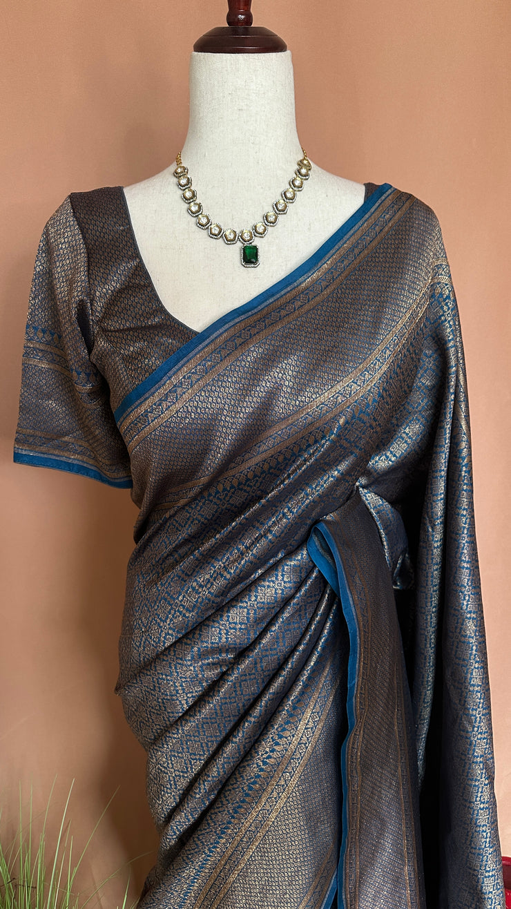 Blue brocade organza saree with stitched blouse